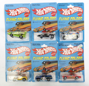 HOTWHEELS: Vintage late 1970s to early 1980s ‘Flying Colors’ including Rodger Dodger (8259) – chrome; and, ’31 Doozie (9649) – green; and, ’56 Hi-Tail Hauler (9647) – orange. All mint and unopened on original cardboard blister packs. (60 items approx.)
