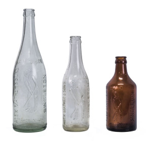 ALEX MATHER Singleton Three Lemonade and Ginger beer bottles each with moulded image of a batsman.
