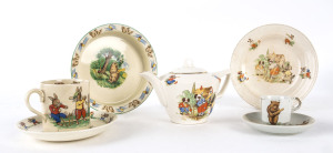 c.1940s-60s collection of child-oriented cricket ceramics including cereal bowls, side plates an egg cup and cups. Bunnies, koalas and puppies enjoying their backyard games. Also includes a "Sergeant Dan, the Creamoata Man" swinging a cricket bat on a gla