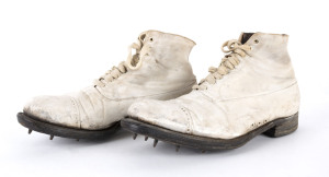 Circa 1920s/30s pair of vintage Cricket Boots; well made of white canvas on the outer and tan leather on the inside of the uppers. They have leather soles with 8 studs on each boot, are lace-ups with 9 pairs of eyelets. (2).