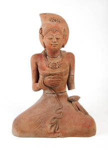 A terracotta figure of a seated lady