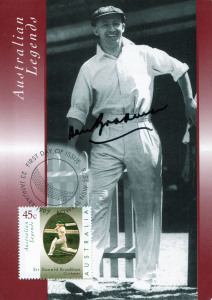 DON BRADMAN photograph signed in pen (25 x 20cm) and an Australian Legends - Don Bradman postcard postmarked at Bowral on the first day of issue, signed by Bradman with a felt-tipped pen. (2 items).