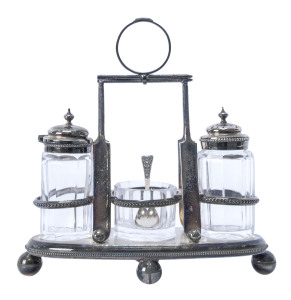 Silver plated cruet set, early 20th century, caddy with cricket bats, balls and other adornments, original glass fittings.