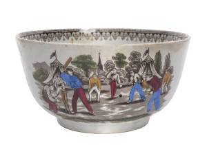 Village cricket bowl. Staffordshire 19th century bowl, transfer printed in sepia with two scenes of village cricket, with church and tents to background, floral and oak leaf inner rim decoration. Hand coloured in green, burgundy, yellow and blue. Approx 1