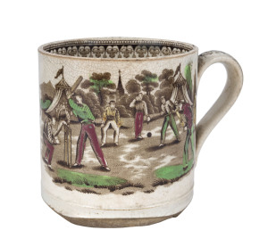 Village cricket mug. Staffordshire 19th century, transfer printed in sepia with two scenes of village cricket, with church and tents to background, floral and oak leaf inner rim decoration. Hand coloured in green, burgundy and yellow. Approx 10.5cm diamet