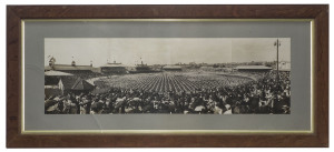 A collection of framed and mostly glazed items; very mixed sizes and subjects but including a panoramic photograph of a marching display at the S.C.G. circa 1908; a reproduction panoramic photo of Larwood bowling ro Bradman at the S.C.G. December 1932; a 
