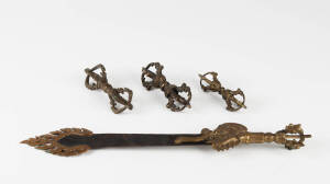 Three Tibetan bronze dorje vajra 10 to 12cm long, and a bladed instrument 30cm long