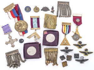 Military badges, medallions, two 1951 silver crowns, Masonic medals, buttons, buckle and accoutrements, 19th and 20th century, (41 items)