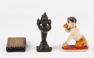 An Indian painted alabaster figure of a boy, 12cm high (stand) and a bronze figure of a deity holding an offering bowl 13cm high