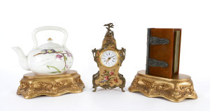 A Swiss mantle clock, antique English teapot, bakelite book box and two gilt wood stands