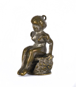 A novelty silver plated cigar cutter fob in the form of a naked lady, late 19th century