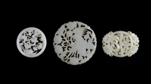 Three Chinese carved jade discs, 19th/20th century