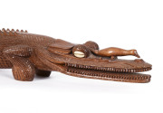 A fine carved wooden crocodile ornament with shell eyes, Papua New Guinea, 20th century - 2