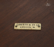 LIBERTY & CO. English arts and crafts occasional table inlaid with tudor rose motif, walnut, satinwood, ebony and beech circa 1900, ivorine makers plaque "Liberty & Co Ltd London W." - 2