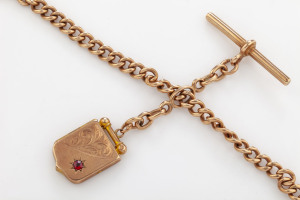 An antique fob chain with locket, 9ct rose gold and garnet, 19th century
