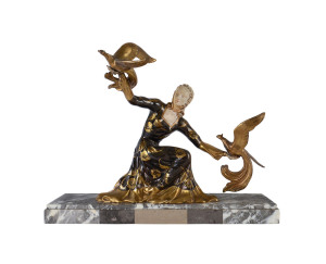 A French Art Deco figure group, gilded and patinated metal, ivorine and marble, circa 1930