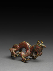 A Sino-Tibetan gilt bronze and cloisonne dragon finial (or possibly a handle), 17th/18th century