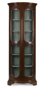 A corner display cabinet, curved front with upholstered interior, 20th century