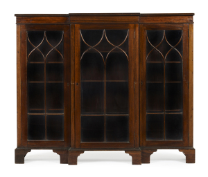 A breakfront three-door bookcase, astragal glazed doors, walnut, early 20th century