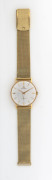 MOVADO Manual gents wristwatch in 14ct gold case, baton numerals with subsidiary seconds