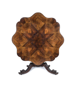 An Exhibition loo table, walnut, circa 1850 superbly crafted with book match veneered starburst shaped top with finely carved column and base, Exhibition label and owner's details attached and inscribed to the top and the base "No. 113, R.O. Blackwood, An