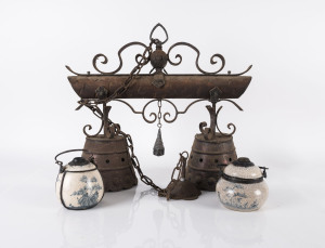 Burmese cow bells converted into a hanging light and two porcelain opium pots, 20th century