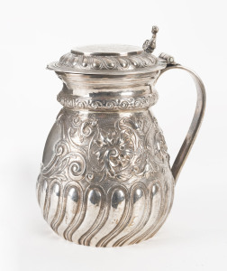 An 18th century sterling silver tankard with armorial top, Newcastle, marks only partially legible,
