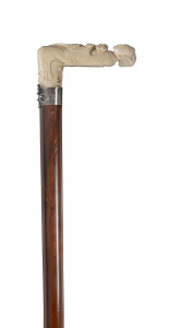 A Chinese walking stick with carved ivory figured handle and silver collar, 19th century