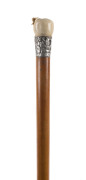 A walking stick, carved apple ivory handle with silver collar and cane shaft, Chinese, 19th century