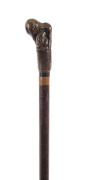 A walking stick with carved figure in the handle, Japanese, 19th century