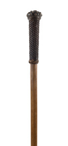 A walking stick with woven leather handle studded with brass, beech shaft, 19th century