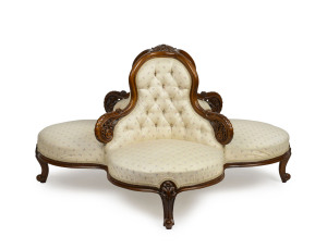 A fine Victorian conversation seat, carved walnut frame, circa 1870