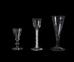 Three antique wine and cordial glasses including air twist stem and engraved Scottish example, 18th century