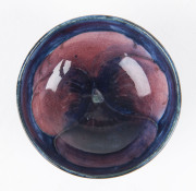 MOORCROFT Pansy patterned miniature bowl on blue ground, circa 1920s - 2