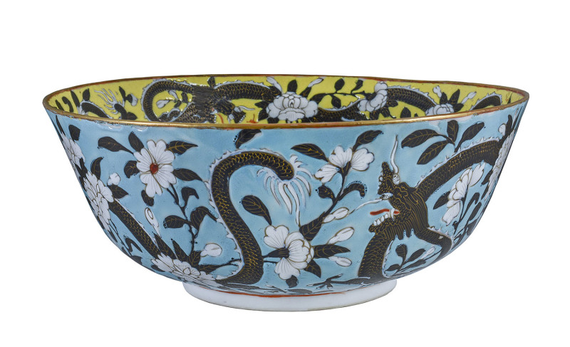 A fine Chinese porcelain bowl decorated with dragons amidst floral motif, glazed in Imperial yellow and turquoise ground, 19th century