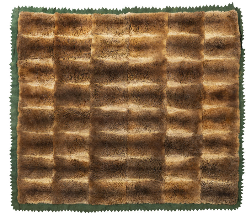 An Australian possum skin rug with green baize backing, 19th century