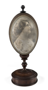 CHARLES WEB GILBERT (1867-1925), Dame Nellie Melba, circa 1902, cameo carved emu egg on blackwood stand, signed lower right and on the base "C. W. Gilbert"
