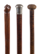 Three Australian walking sticks including casuarina with carved fist handle and two blackwood examples, 19th century,