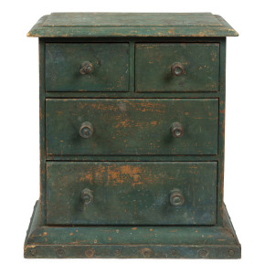 A miniature chest of drawers, pine with green painted finish, late 19th century