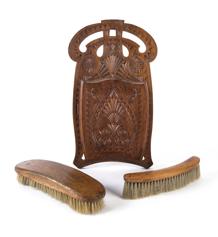 A chip carved brush holder and brushes, kauri pine, 19th century