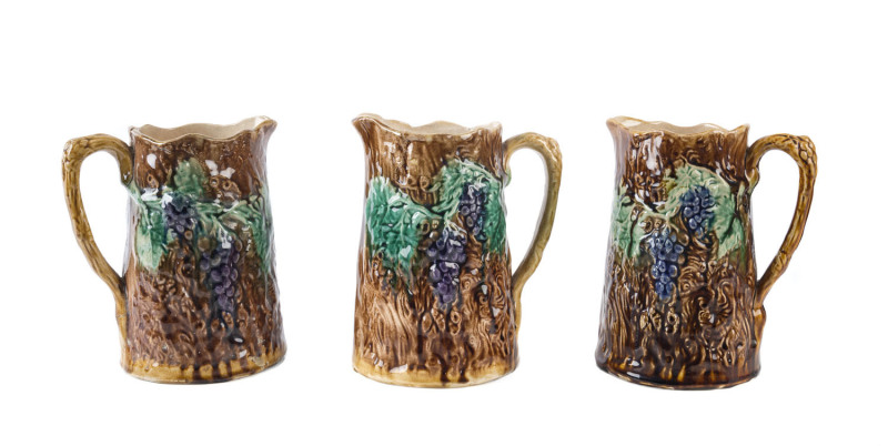 BENDIGO POTTERY Set of three majolica glazed harvest jugs, 19th century