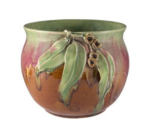 REMUED Pottery jardiniere with applied gumnuts and leaves, incised markings, early pink and green glaze, circa 1933