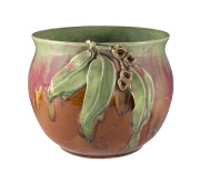 REMUED Pottery jardiniere with applied gumnuts and leaves, incised markings, early pink and green glaze, circa 1933