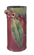 REMUED Pottery cylindrical vase with gumnuts and leaf, early pink and green glaze with blue interior, circa 1933, incised "Remued, Hand Made, 145/GM"