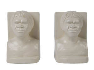 MELROSE WARE Rare pair of Aboriginal bust bookends in cream glazed pottery, stamped "Melrose Ware, Australia"