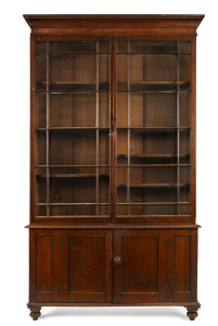 An early library bookcase with astragal glazed doors, Australian cedar, Tasmanian origin, circa 1830, Hobart address on the back,