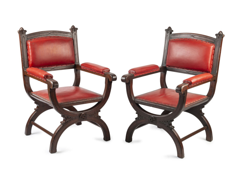 A fine pair of Australian cedar Gothic armchairs purported to have come from the original Melbourne stock exchange, mid 19th century