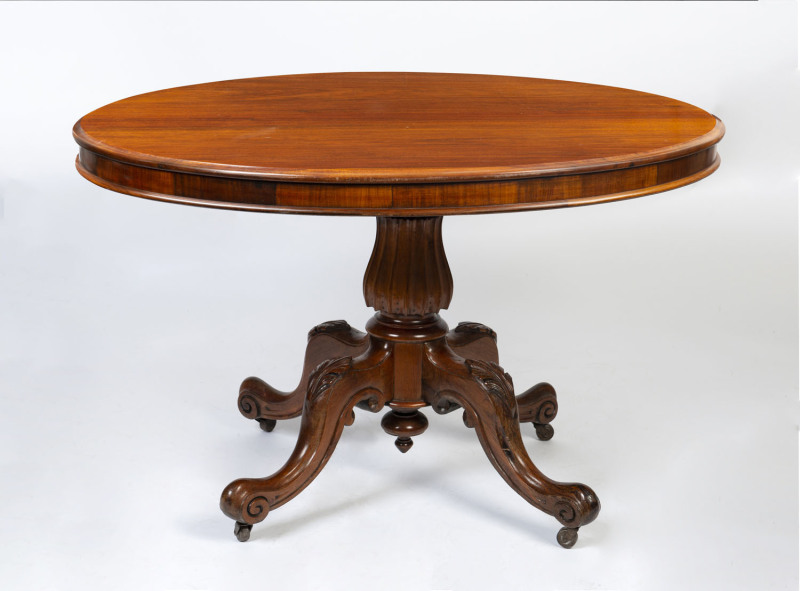 A Colonial tilt-top oval supper table with unusual carved column and base, blackwood, Tasmanian origin, mid 19th century