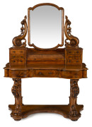 A Victorian dressing table with cylinder rolled top and carved base, Tasmanian huon pine, circa 1875