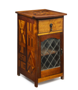 An Australian music roll or bedside cabinet inlaid blackwood and maple with Australian map on the top and adorned with charms and symbols on the sides, circa 1920